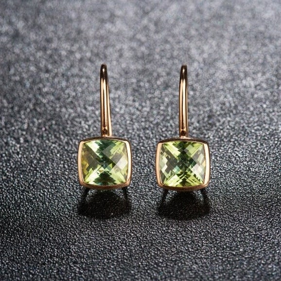 14k Gold 3 Ct Natural Tourmaline Earrings: Ref:231132246 // gold content:14k gold // main gemstone:tourmaline // shape:cushion // carat weight:3ct // color:yellowish green // treatment:natural // High Estimate: 3300Condition: NewLow