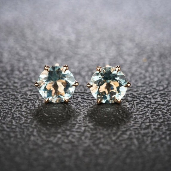 14k Gold 2 Ct Natural Aquamarine Earrings: Ref:231132258 // gold content:14k gold // main gemstone:aquamarine // shape:round // carat weight:2ct // color:blue // treatment:natural // cut grade:g // Condition: New Low Estimate: 1700.00 High Es