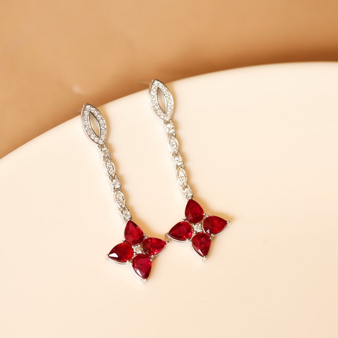 14k Gold 2.45 Ctw Natural Ruby & Diamond Earrings: Ref:231132278 // gold content:14k gold // main gemstone:ruby // shape:pear // carat weight:2. 15ct // color:red // treatment:natural // // adjacent gemstone 2 : diamond // shape:round // carat