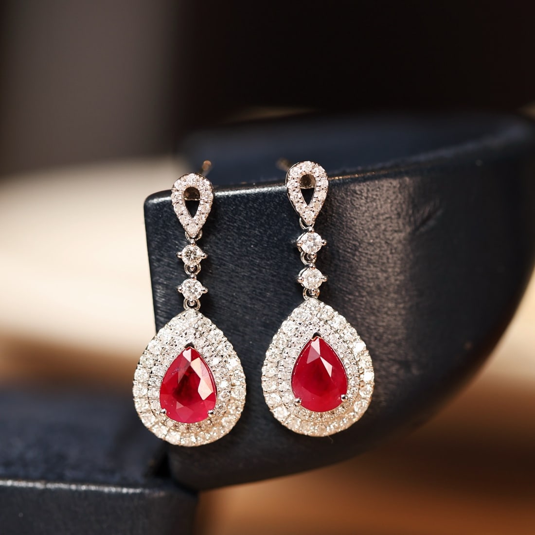 14k Gold 2.96 Ctw Natural Ruby & Diamond Earrings: Ref:231132372 // gold content:14k gold // main gemstone:ruby // shape:pear // carat weight:2. 07ct // color:red // treatment:natural // // adjacent gemstone 2 : diamond // shape:round // carat