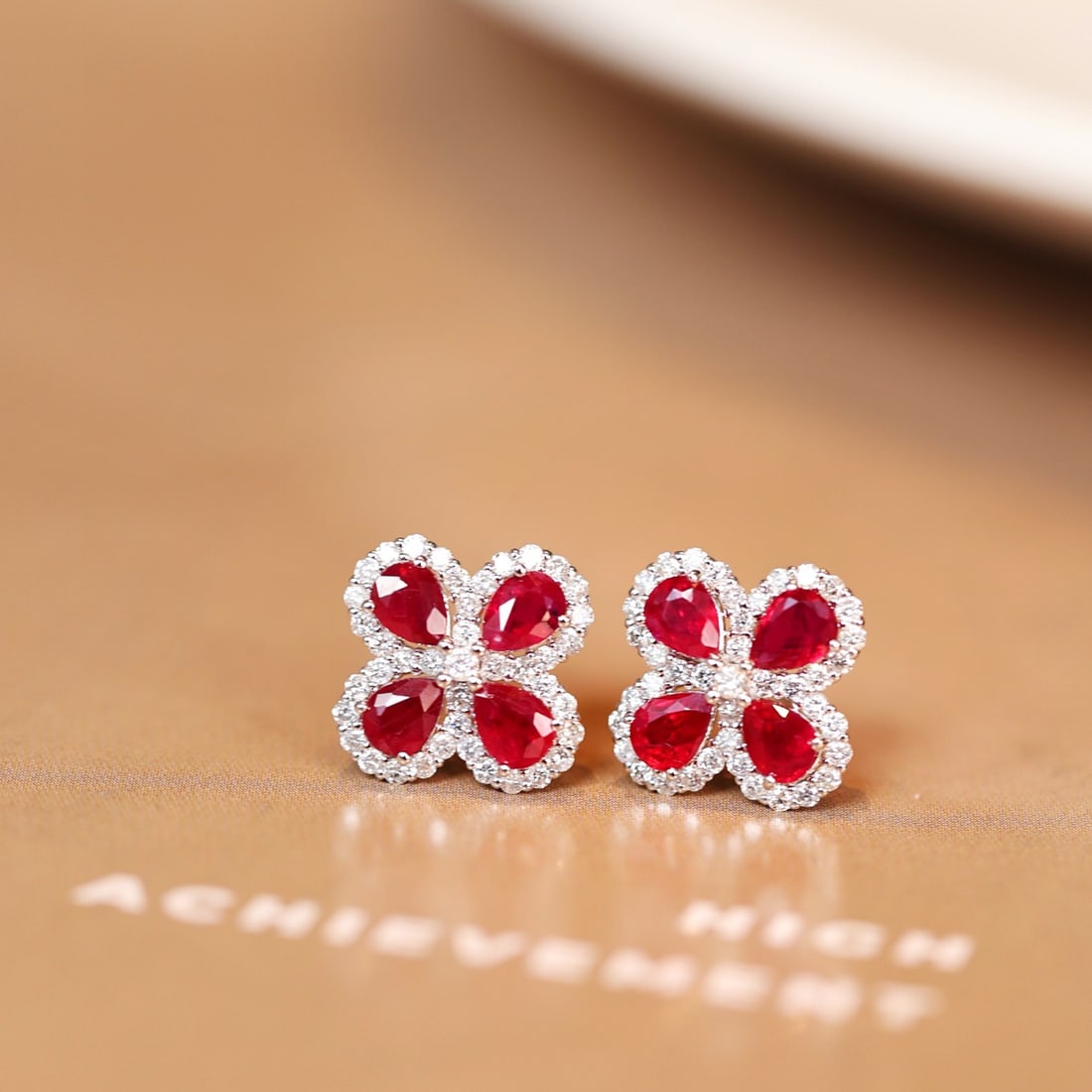 14k Gold 1.89 Ctw Natural Ruby & Diamond Earrings: Ref:231132390 // gold content:14k gold // main gemstone:ruby // shape:pear // carat weight:1. 46ct // color:red // treatment:natural // // adjacent gemstone 2 : diamond // shape:round // carat