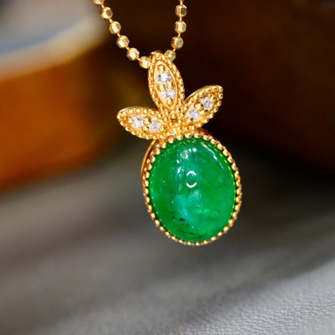 14k Gold 2.29 Ctw Natural Emerald & Diamond Pendant( Without Chain ): Ref:231132405 // gold content:14k gold // main gemstone:emerald // shape:oval // carat weight:2. 26ct // color:green // treatment:natural // // adjacent gemstone 2 : diamond // shape:round // carat