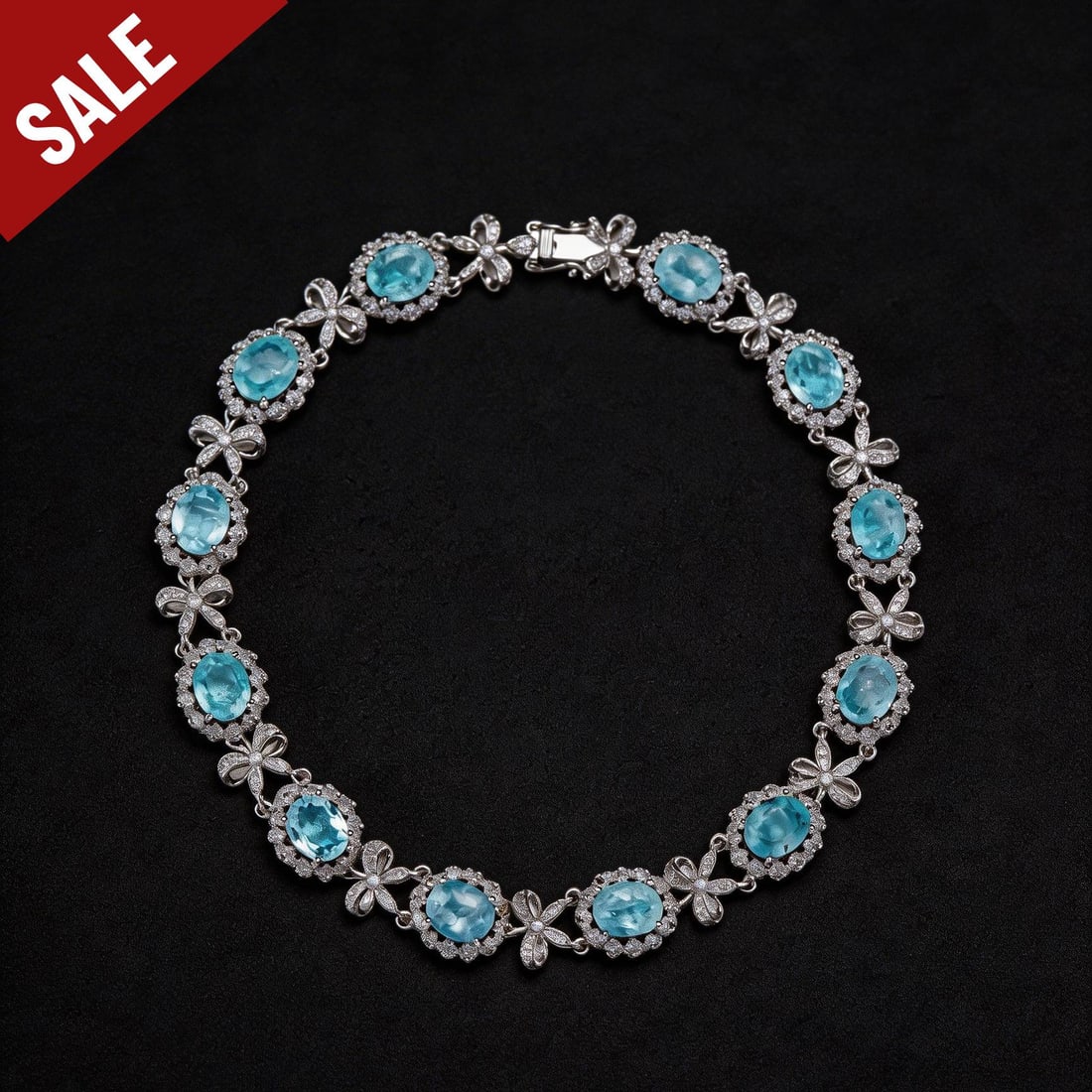 14k Gold 6.2 Ct Natural Paraiba Tourmaline & Diamond Bracelet: Ref:230794047 // gold content:14k gold // main gemstone:paraiba tourmaline // shape:oval // carat weight:6. 2ct // color:blue // treatment:natural // // adjacent gemstone 2 : diamond // shape:round
