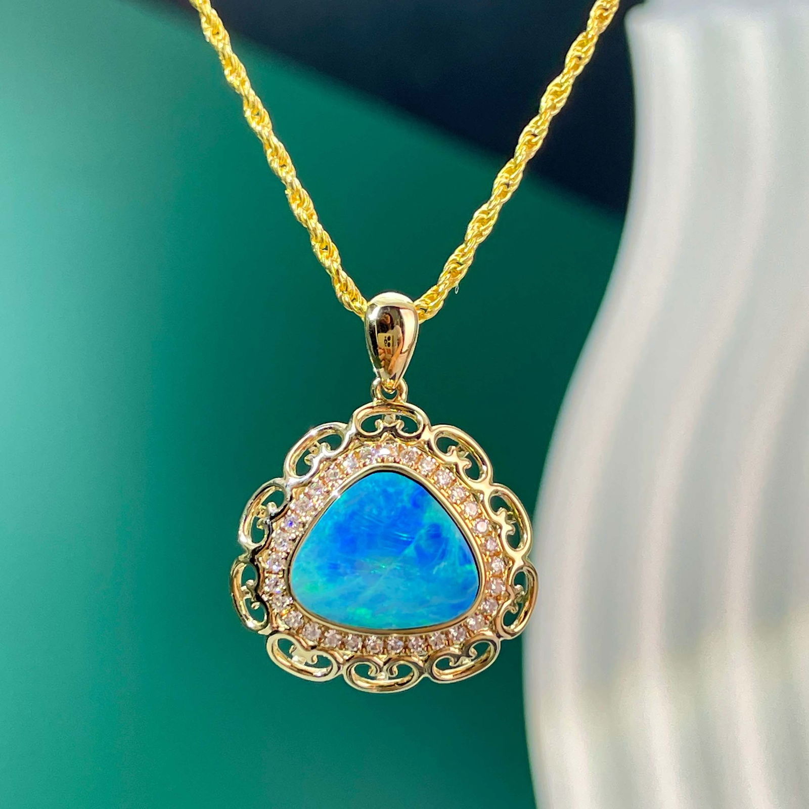 14k Gold 1.72 Ct Natural Opal & Diamond Pendant( Without Chain ): Ref:230999008 // gold content:14k gold // main gemstone:opal // shape:triangle // carat weight:1. 72ct // color:color // treatment:natural // // adjacent gemstone 2 : diamond // number of stones:31