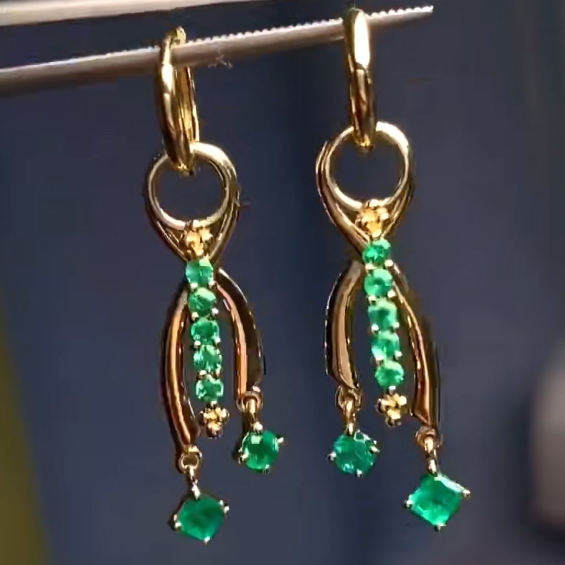 14k Gold 0.64 Ct Vivid Green Natural Emerald Earrings: Ref:230999013 // gold content:14k gold // main gemstone:emerald // shape:multiply // carat weight:0. 64ct // color:vivid green // treatment:natural // Condition: NewLow Estimate: 3700.00High