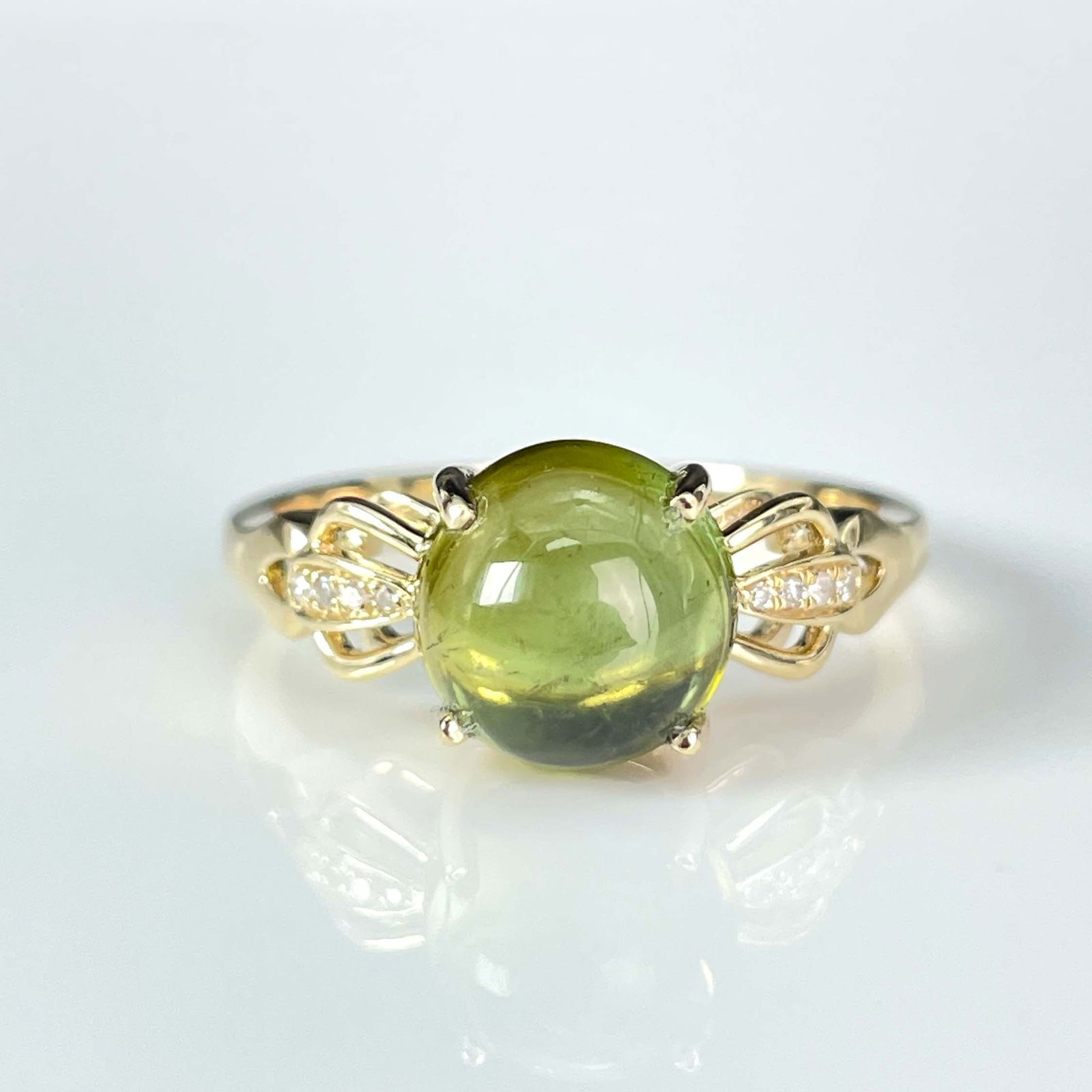 14k Gold 2.1 Ct Natural Tourmaline & Diamond Ring: Ref:230999025 // gold content:14k gold // ring size:7. 25us // // main gemstone:tourmaline // shape:round // carat weight:2. 1ct // color:green // treatment:natural // cut grade:g // // adjacent