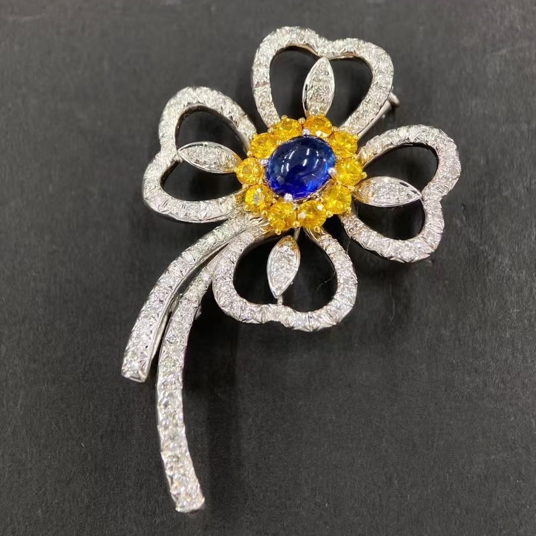 14k Gold 2.07 Ctw Natural Sapphire & Sapphire Brooch: Ref:230999118 // gold content:14k gold // main gemstone:sapphire // shape:oval // carat weight:1. 25ct // color:blue // treatment:natural // // adjacent gemstone 2 : sapphire // shape:round // carat w