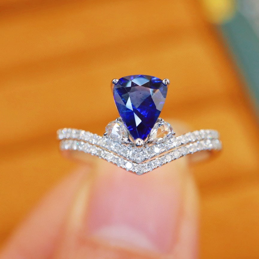 14k Gold 1.43 Ctw Natural Sapphire & Diamond Ring: Ref:231000103 // gold content:14k gold // ring size:7. 25us // // main gemstone:sapphire // shape:pear // carat weight:1. 12ct // color:royal blue // treatment:natural // // adjacent gemstone 2 :