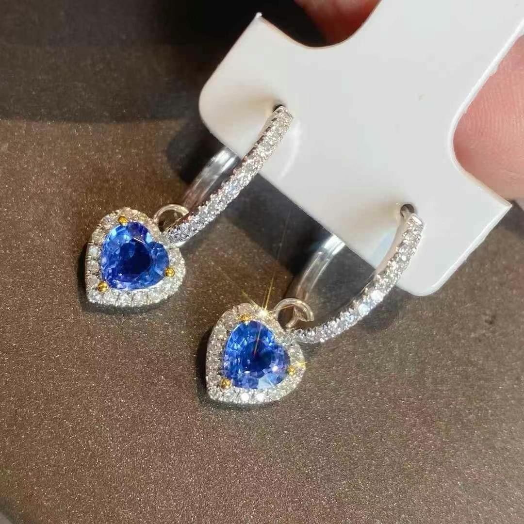 14k Gold 2.00 Ctw Natural Sapphire & Diamond Earrings: Ref:231000118 // gold content:14k gold // main gemstone:sapphire // shape:heart // carat weight:1. 55ct // color:cornflower blue // treatment:natural // // adjacent gemstone 2 : diamond //
