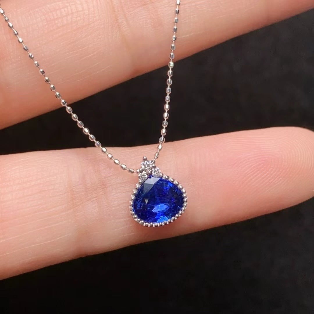14k Gold 1.22 Ct Natural Sapphire & Diamond Necklace: Ref:231000163 // gold content:14k gold // main gemstone:sapphire // shape:pear // carat weight:1. 22ct // color:blue // treatment:natural // // adjacent gemstone 2 : diamond // number of stones:3 // s