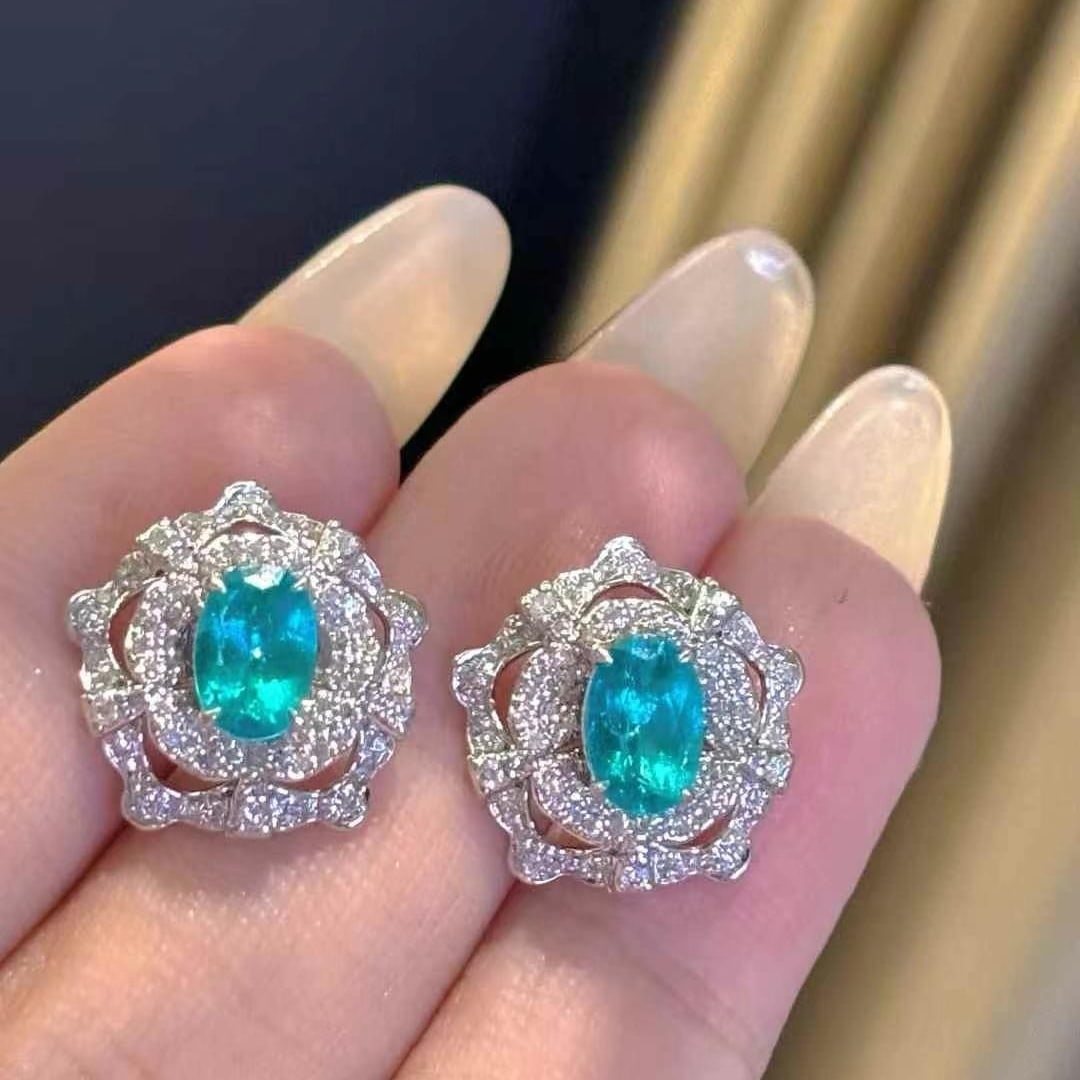 14k Gold 1.26 Ct Natural Paraiba Tourmaline & Diamond Earrings: Ref:231000165 // gold content:14k gold // main gemstone:paraiba tourmaline // shape:oval // carat weight:1. 26ct // color:blue // treatment:natural // // adjacent gemstone 2 : diamond // shape:round /