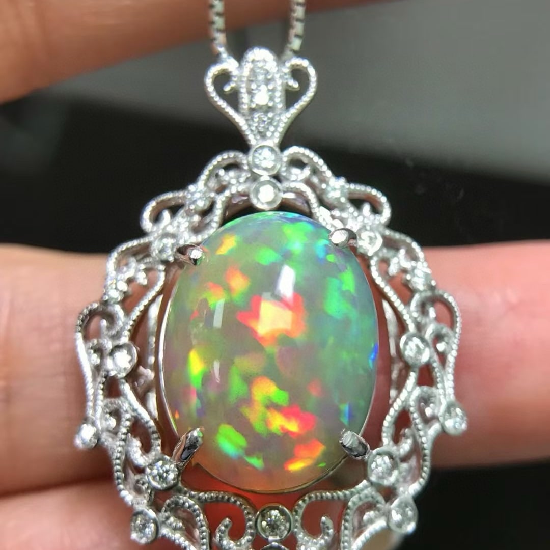 14k Gold 7.37 Ctw Natural Opal & Diamond Pendant( Without Chain ): Ref:231000183 // gold content:14k gold // main gemstone:opal // shape:oval // carat weight:7. 15ct // color:color // treatment:natural // // adjacent gemstone 2 : diamond // shape:round // carat weigh