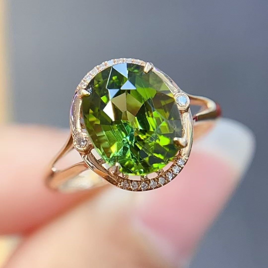 14k Gold 3.00 Ct Natural Tourmaline & Diamond Ring: Ref:231000189 // gold content:14k gold // ring size:7. 25us // // main gemstone:tourmaline // shape:oval // carat weight:3. 00ct // color:green // treatment:natural // // adjacent gemstone 2 :