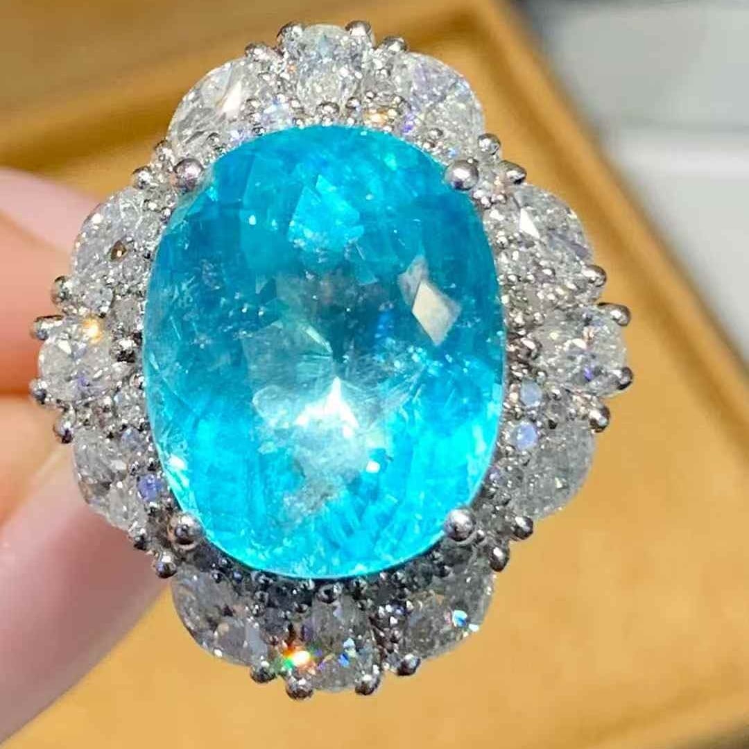 14k Gold 8.6 Ct Natural Paraiba Tourmaline & Diamond Ring: Ref:231101095 // gold content:14k gold // ring size:7. 25us // // main gemstone:paraiba tourmaline // shape:oval // carat weight:8. 6ct // color:blue // treatment:natural // // adjacent gemstone 2 : d