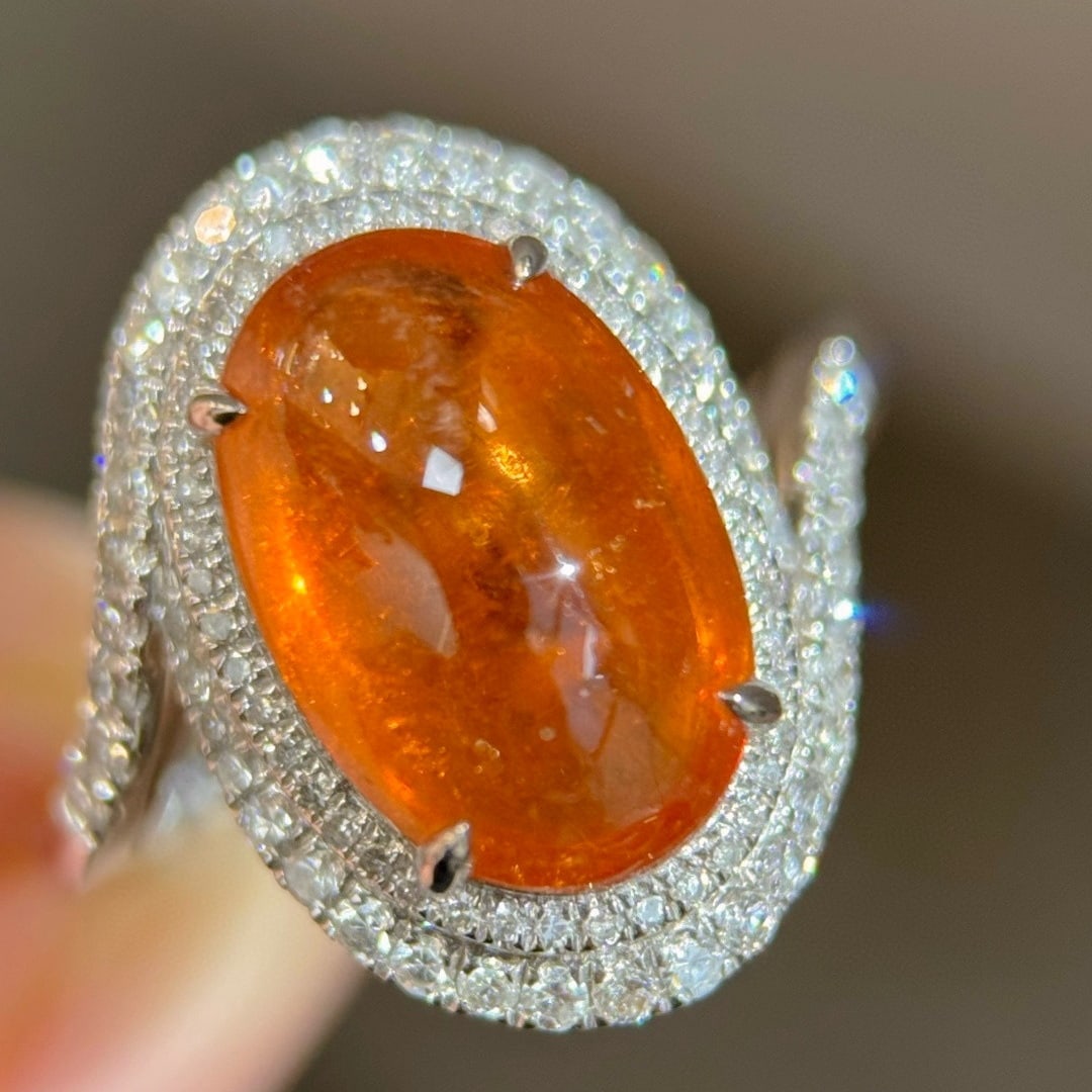 14k Gold 6.85 Ctw Natural Spessartine & Diamond Ring: Ref:231101130 // gold content:14k gold // ring size:7. 25us // // main gemstone:spessartine // shape:oval // carat weight:6. 33ct // color:orange // treatment:natural // // adjacent gemstone 2 : diamo