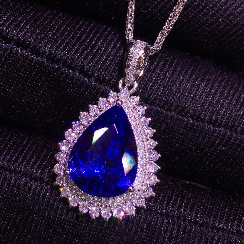 14k Gold 4.1 Ct Natural Tanzanite & Diamond Pendant( Without Chain ): Ref:231101248 // gold content:14k gold // main gemstone:tanzanite // shape:pear // carat weight:4. 1ct // color:blue // treatment:natural // // adjacent gemstone 2 : diamond // shape:round // clarity