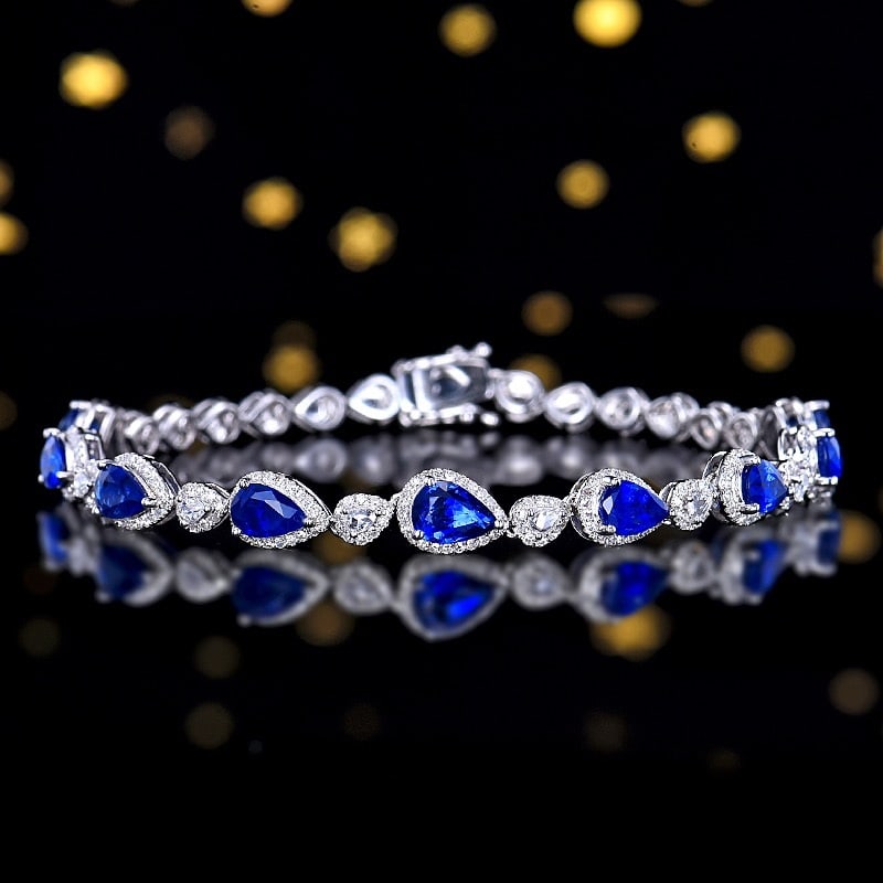 14k Gold 4.81 Ctw Natural Sapphire & Diamond Bracelet: Ref:231102036 // gold content:14k gold // main gemstone:sapphire // shape:pear // carat weight:3. 73ct // color:blue // treatment:natural // // adjacent gemstone 2 : diamond // number of stones:300 //