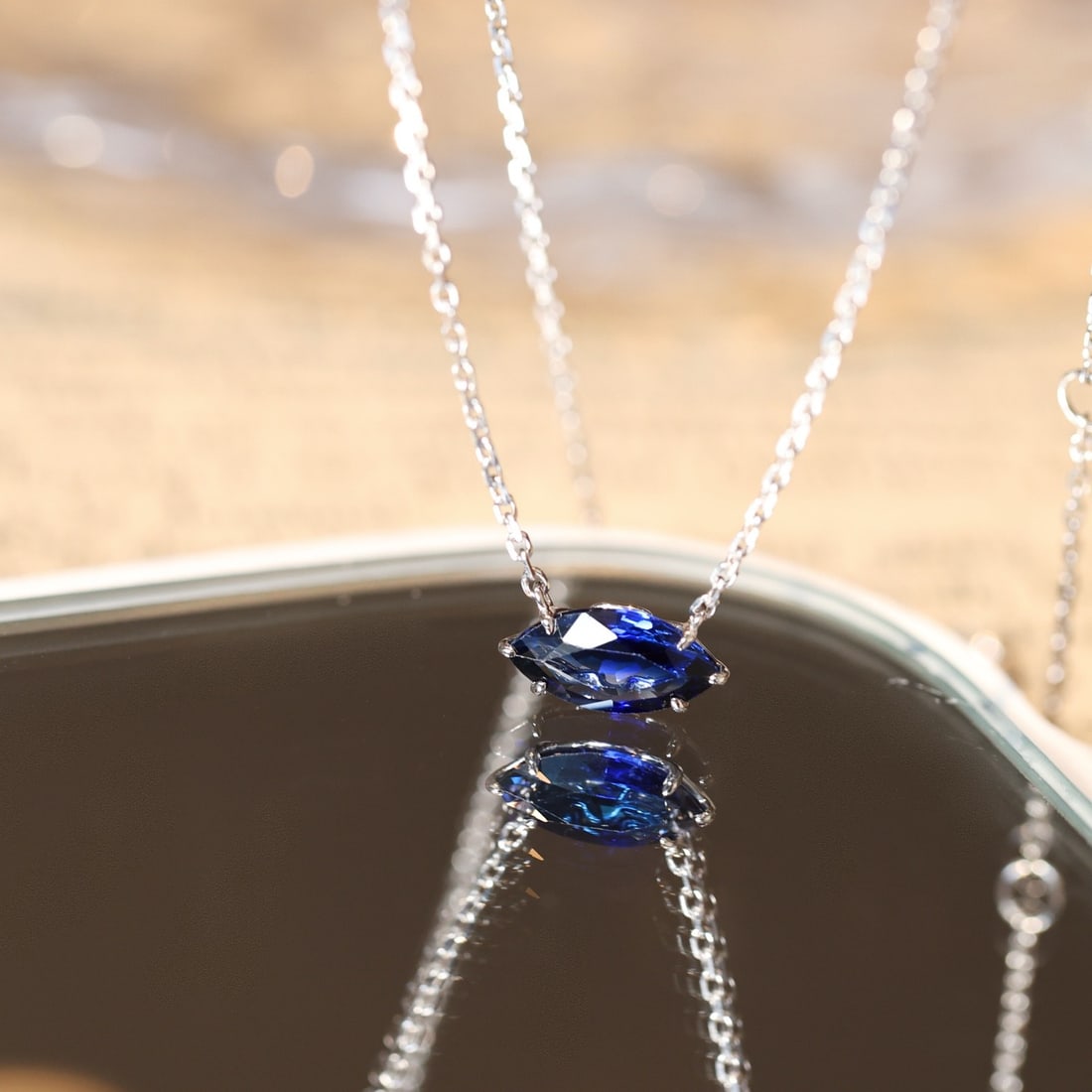 14k Gold 1.06 Ct Natural Sapphire Necklace: Ref:231102102 // gold content:14k gold // main gemstone:sapphire // shape:marquise // carat weight:1. 06ct // color:blue // treatment:natural // Condition: NewLow Estimate: 3500.00High Estimate: