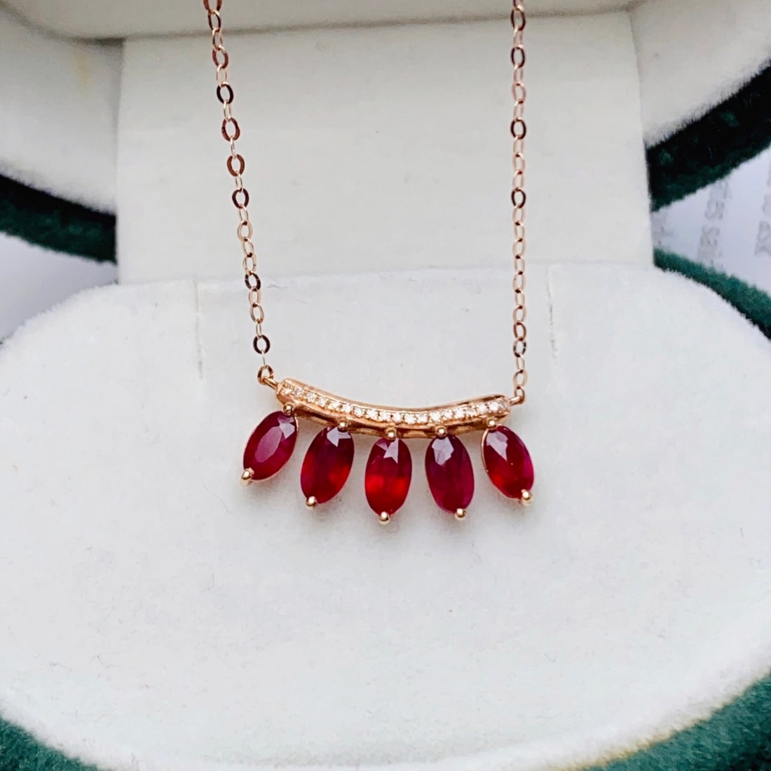 14k Gold 1.65 Ct Natural Ruby & Diamond Necklace: Ref:231102157 // gold content:14k gold // main gemstone:ruby // shape:oval // carat weight:1. 65ct // color:red // treatment:natural // // adjacent gemstone 2 : diamond // number of stones:19 // shape