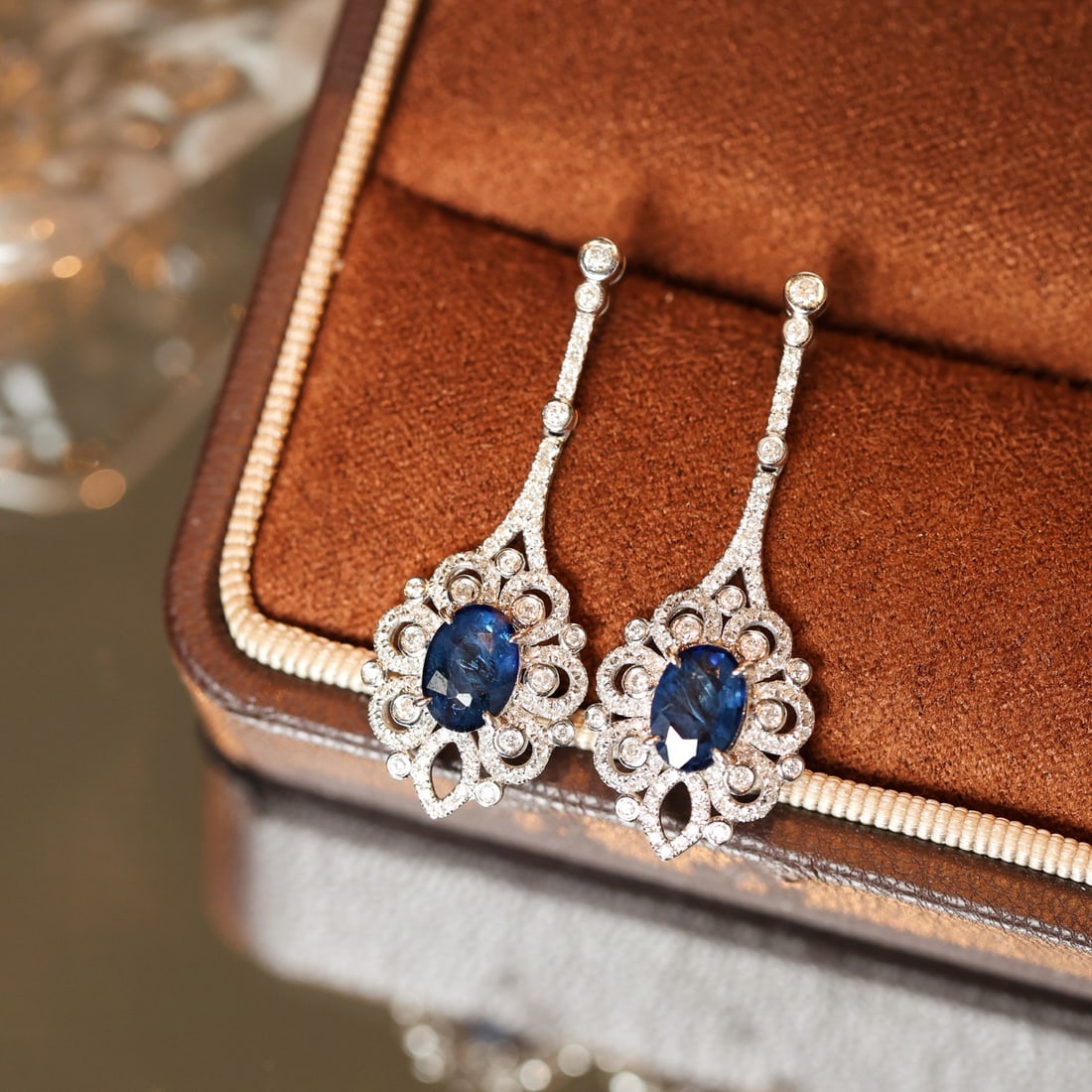 14k Gold 2.76 Ctw Natural Sapphire & Diamond Earrings: Ref:231102211 // gold content:14k gold // main gemstone:sapphire // shape:oval // carat weight:2. 03ct // color:blue // treatment:natural // // adjacent gemstone 2 : diamond // shape:round // carat