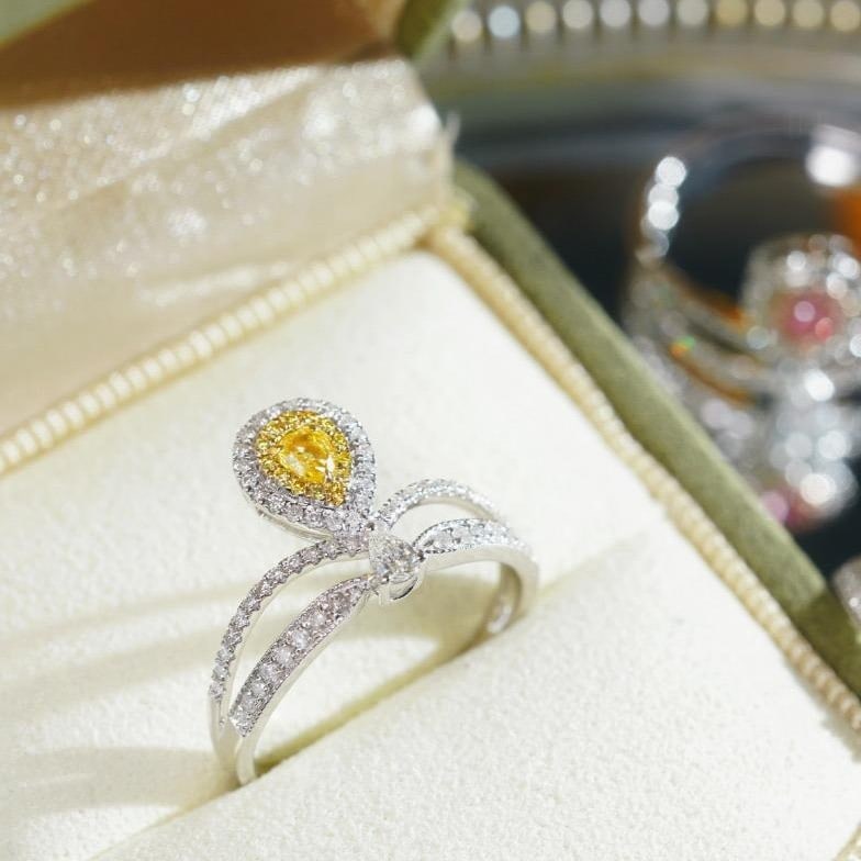 14k Gold 0.45 Ctw Natural Yellow Diamond & Diamond Ring: Ref:231102219 // gold content:14k gold // ring size:7. 25us // // main gemstone:yellow diamond // shape:pear // carat weight:0. 12ct // color:yellow // treatment:natural // // adjacent gemstone 2