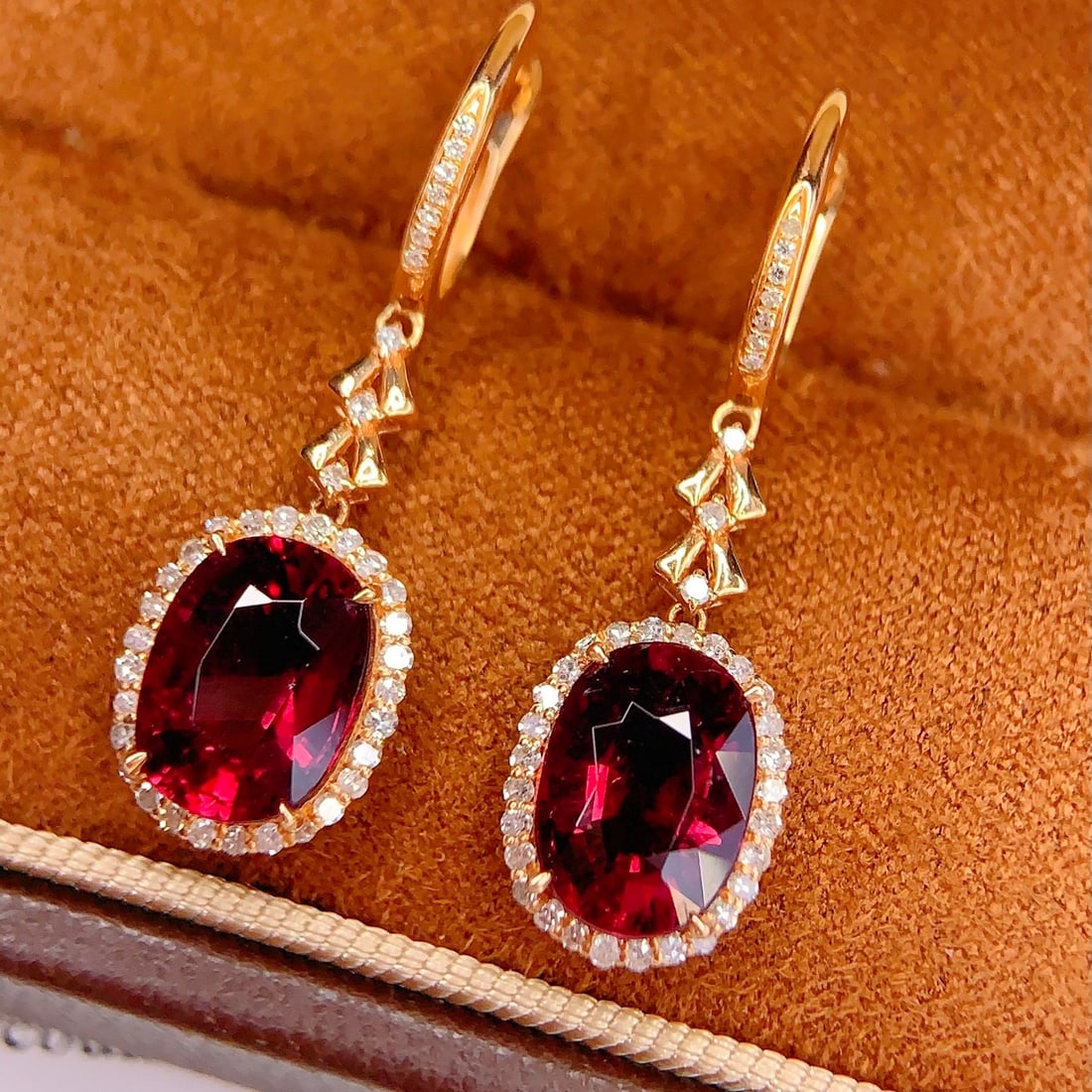14k Gold 6 Ct Natural Tourmaline & Diamond Earrings: Ref:231102286 // gold content:14k gold // main gemstone:tourmaline // shape:oval // carat weight:6ct // color:red // treatment:natural // // adjacent gemstone 2 : diamond // number of stones:76 //