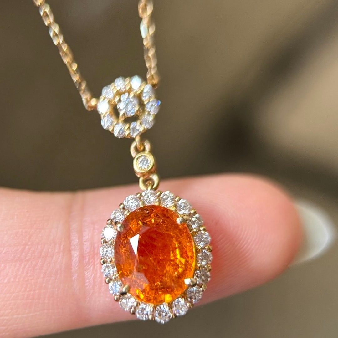 14k Gold 3.31 Ctw Natural Spessartine & Diamond Necklace: Ref:231102359 // gold content:14k gold // main gemstone:spessartine // shape:oval // carat weight:2. 90ct // color:orange // treatment:natural // // adjacent gemstone 2 : diamond // shape:round //
