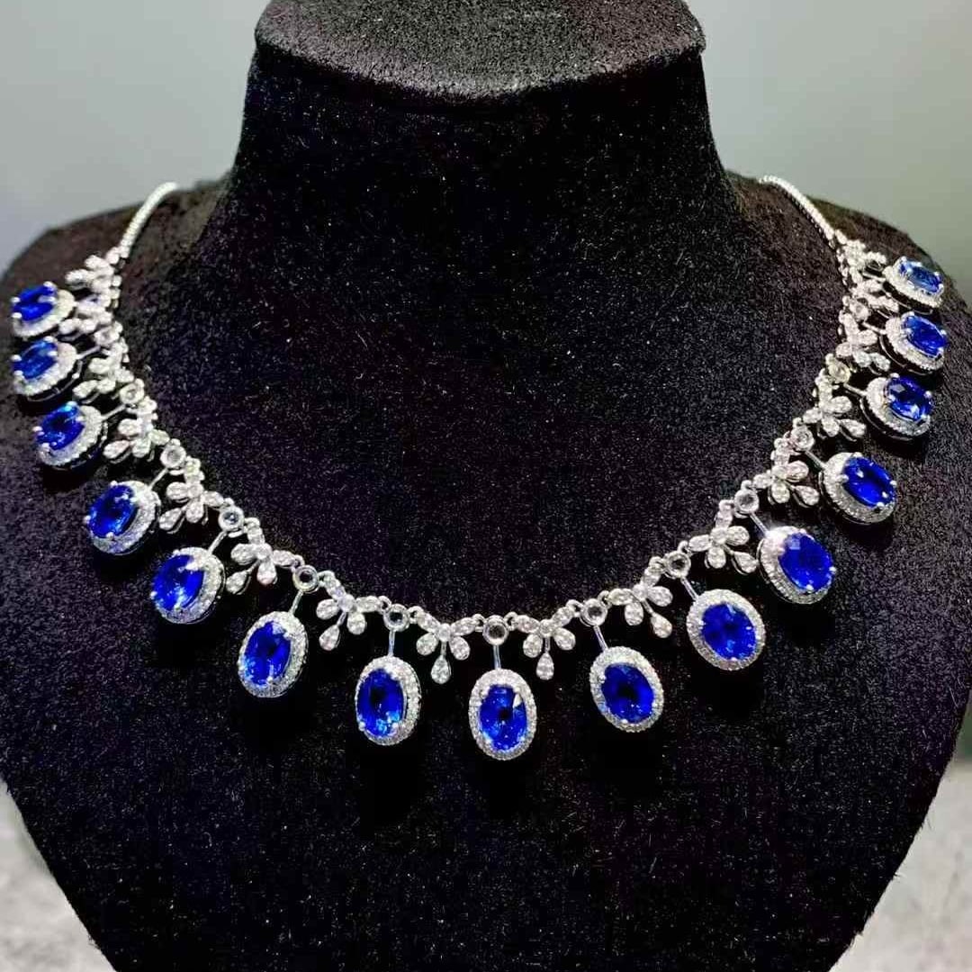 14k Gold 9.3 Ct Vivid Blue Natural Sapphire & Diamond & Sapphire Necklace: Ref:231103023 // gold content:14k gold // main gemstone:sapphire // shape:oval // carat weight:9. 3ct // color:vivid blue // treatment:natural // // adjacent gemstone 2 : diamond // shape:round //