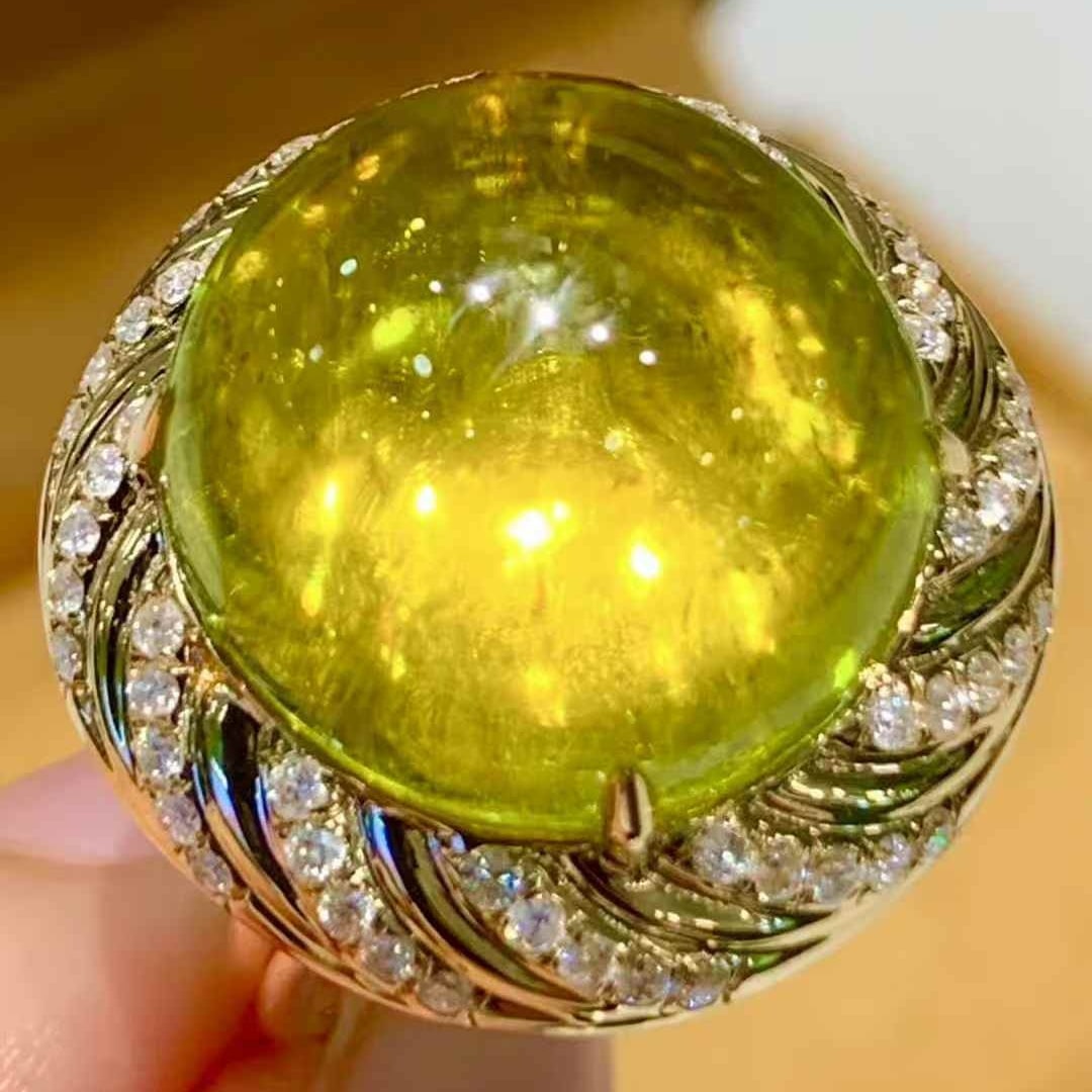 14k Gold 15.6 Ct Natural Tourmaline & Diamond Ring: Ref:231103129 // gold content:14k gold // ring size:7. 25us // // main gemstone:tourmaline // shape:oval // carat weight:15. 6ct // color:yellow // treatment:natural // // adjacent gemstone 2 :