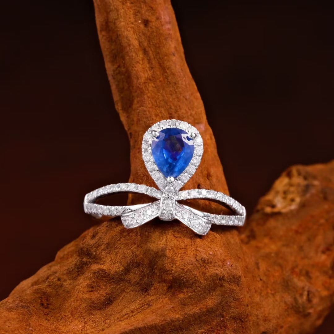 14k Gold 1.20 Ctw Natural Sapphire & Diamond Ring: Ref:231103245 // gold content:14k gold // ring size:7. 25us // // main gemstone:sapphire // shape:pear // carat weight:0. 85ct // color:blue // treatment:natural // // adjacent gemstone 2 :