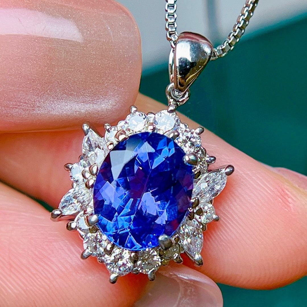 14k Gold 3.83 Ctw Natural Tanzanite & Diamond Pendant( Without Chain ): Ref:231103253 // gold content:14k gold // main gemstone:tanzanite // shape:oval // carat weight:2. 8ct // color:blue // treatment:natural // // adjacent gemstone 2 : diamond // shape:multiple //