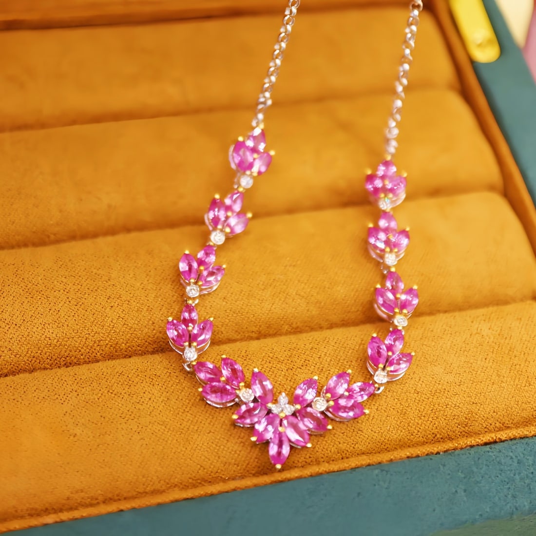 14k Gold 7.35 Ctw Natural Padparadscha Sapphire & Diamond Necklace: Ref:231104078 // gold content:14k gold // main gemstone:padparadscha sapphire // shape:marquise // carat weight:7. 20ct // color:orangish pink // treatment:natural // // adjacent gemstone 2 :