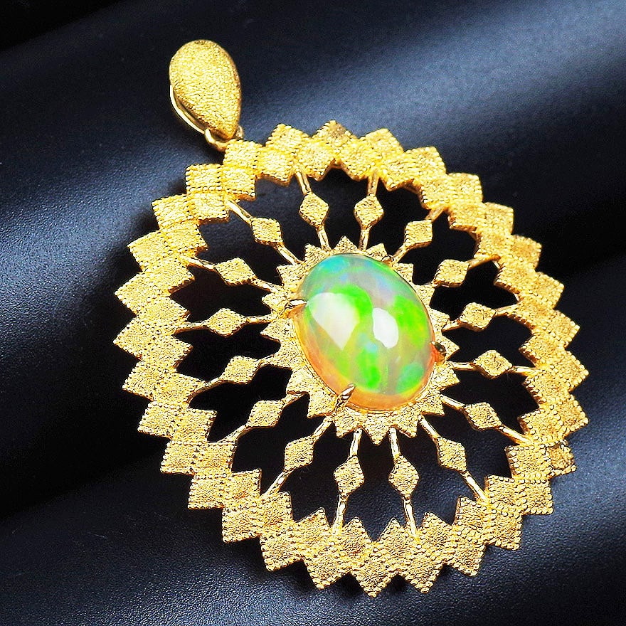 14k Gold 4.63 Ct Natural Opal Pendant( Without Chain ): Ref:231104234 // gold content:14k gold // main gemstone:opal // shape:oval // carat weight:4. 63ct // color:color // treatment:natural // Condition: New Low Estimate: 12000.00 High Estimate: 17000.00