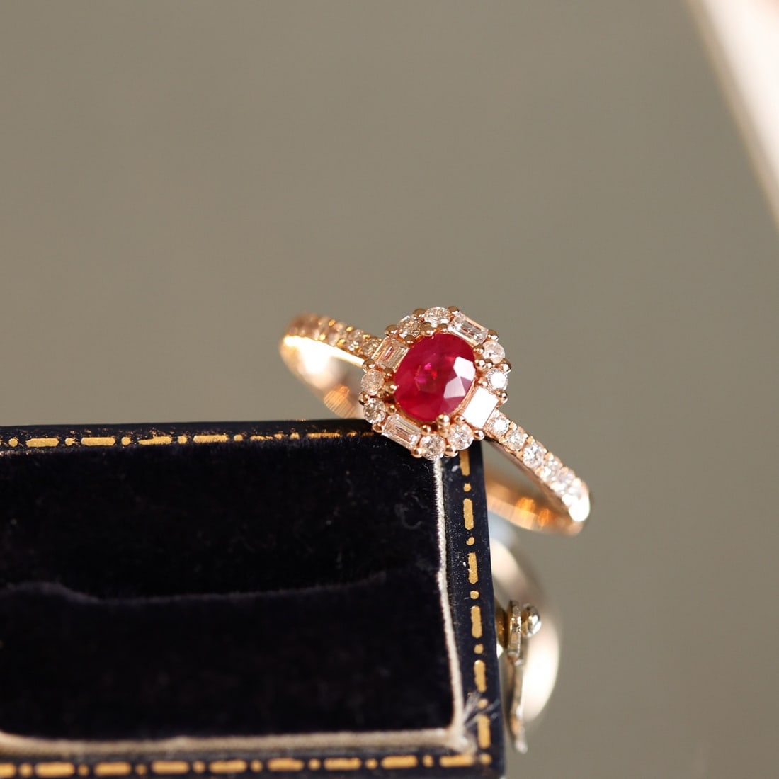 14k Gold 0.95 Ctw Natural Ruby & Diamond Ring: Ref:231104382 // gold content:14k gold // ring size:7. 25us // // main gemstone:ruby // shape:oval // carat weight:0. 56ct // color:pigeonblood red // treatment:natural // // adjacent gemstone 2 :