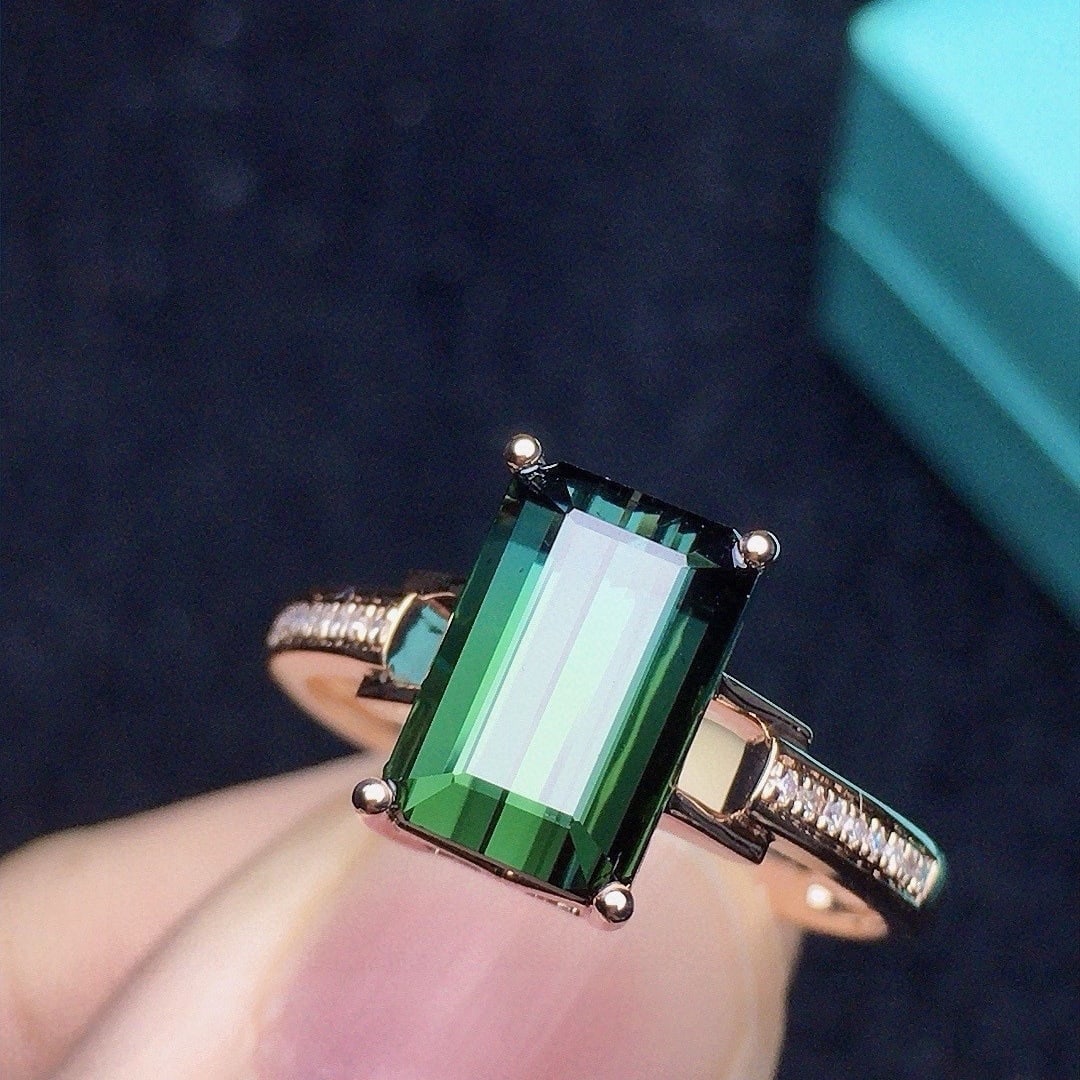 14k Gold 2.48 Ct Natural Tourmaline & Diamond Ring: Ref:231104387 // gold content:14k gold // ring size:7. 25us // // main gemstone:tourmaline // shape:octagonal // carat weight:2. 48ct // color:green // treatment:natural // // adjacent gemstone 2