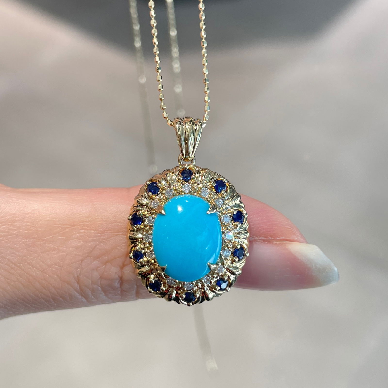 14k Gold 3 Ct Natural Blue Turquoise & Sapphire & Diamond Pendant( Without Chain ): Ref:231104402 // gold content:14k gold // main gemstone:blue turquoise // shape:oval // carat weight:3ct // color:blue // treatment:natural // // adjacent gemstone 2 : sapphire // shape:round // color