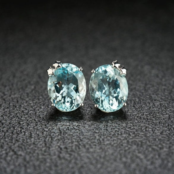 14k Gold 6.05 Ct Natural Aquamarine Earrings: Ref:231105056 // gold content:14k gold // main gemstone:aquamarine // shape:oval // carat weight:6. 05ct // color:blue // treatment:natural // Condition: NewLow Estimate: 3300.00High Estimate: