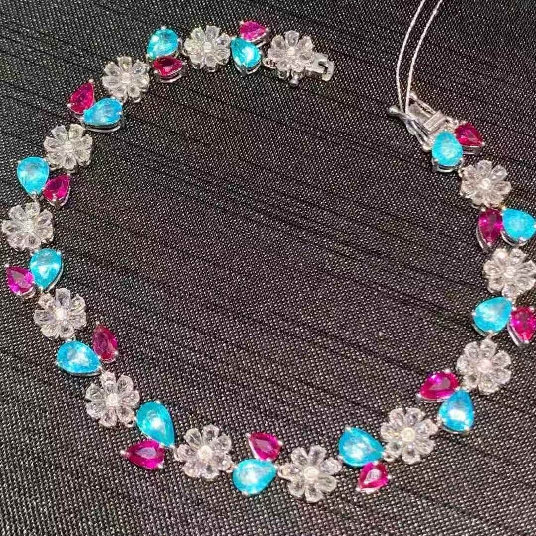 14k Gold 9.3 Ct Natural Paraiba Tourmaline & Ruby & Diamond Bracelet: Ref:231105095 // gold content:14k gold // main gemstone:paraiba tourmaline & ruby // shape:pear // carat weight:9. 3ct // color:blue & red // treatment:natural // // adjacent gemstone 2 : diamond