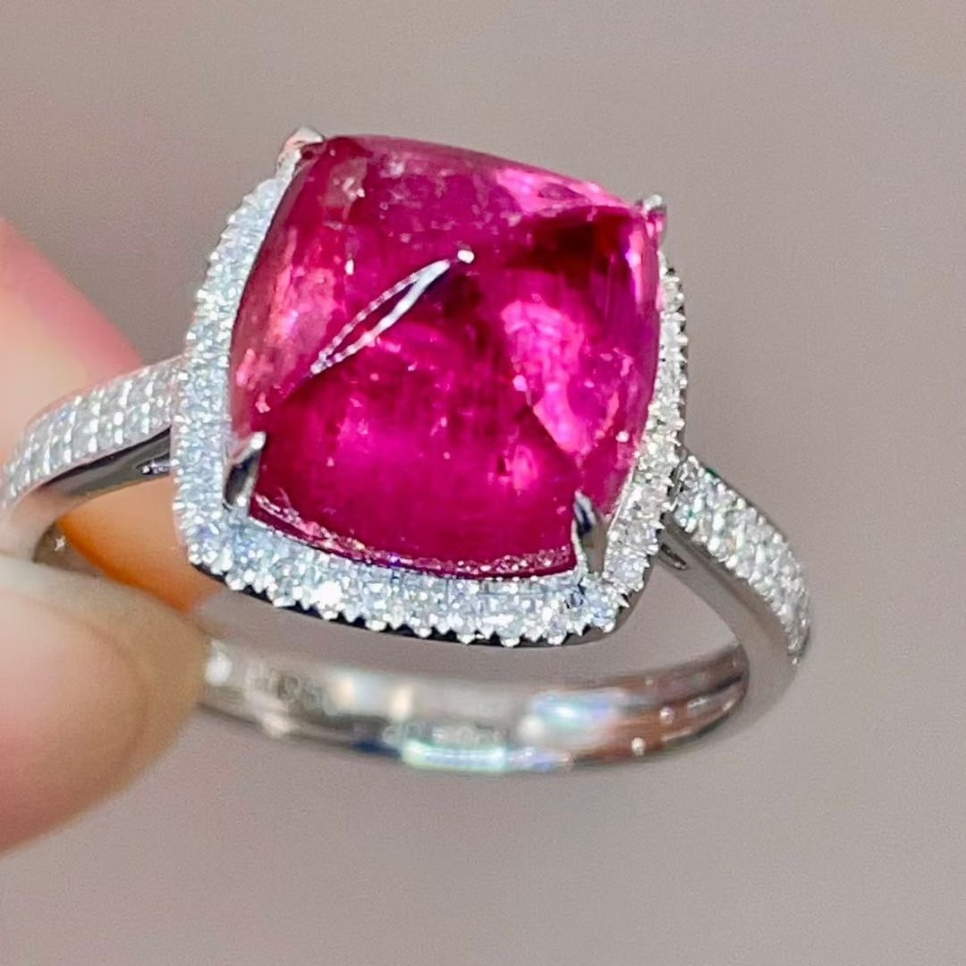 14k Gold 5.15 Ctw Natural Tourmaline & Diamond Ring: Ref:231105140 // gold content:14k gold // ring size:7. 25us // // main gemstone:tourmaline // shape:sugar-loaf // carat weight:4. 85ct // color:pinkish red // treatment:natural // // adjacent gemstone