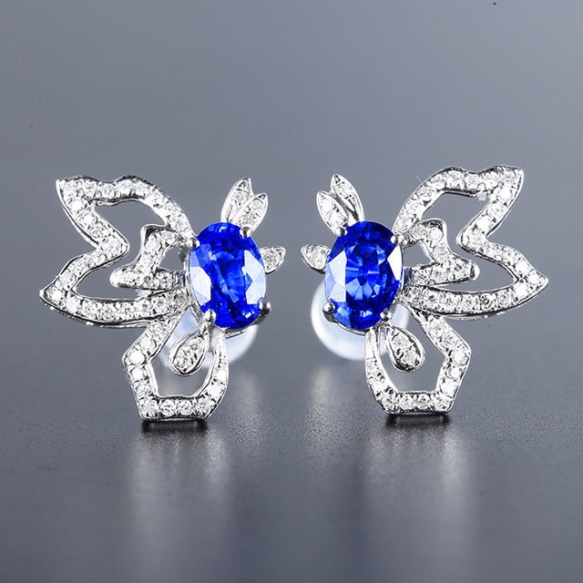 14k Gold 1.45 Ctw Natural Sapphire & Diamond Earrings: Ref:231105196 // gold content:14k gold // main gemstone:sapphire // shape:oval // carat weight:1. 18ct // color:blue // treatment:natural // // adjacent gemstone 2 : diamond // number of stones:92 //