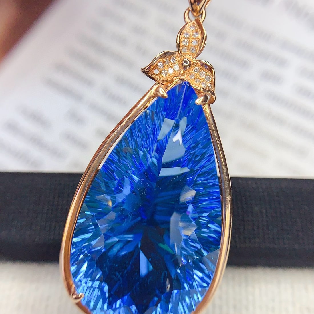 14k Gold 29 Ct Natural Topaz & Diamond Pendant( Without Chain ): Ref:231105233 // gold content:14k gold // main gemstone:topaz // shape:pear // carat weight:29ct // color:blue // treatment:natural // // adjacent gemstone 2 : diamond // number of stones:21 // shape: