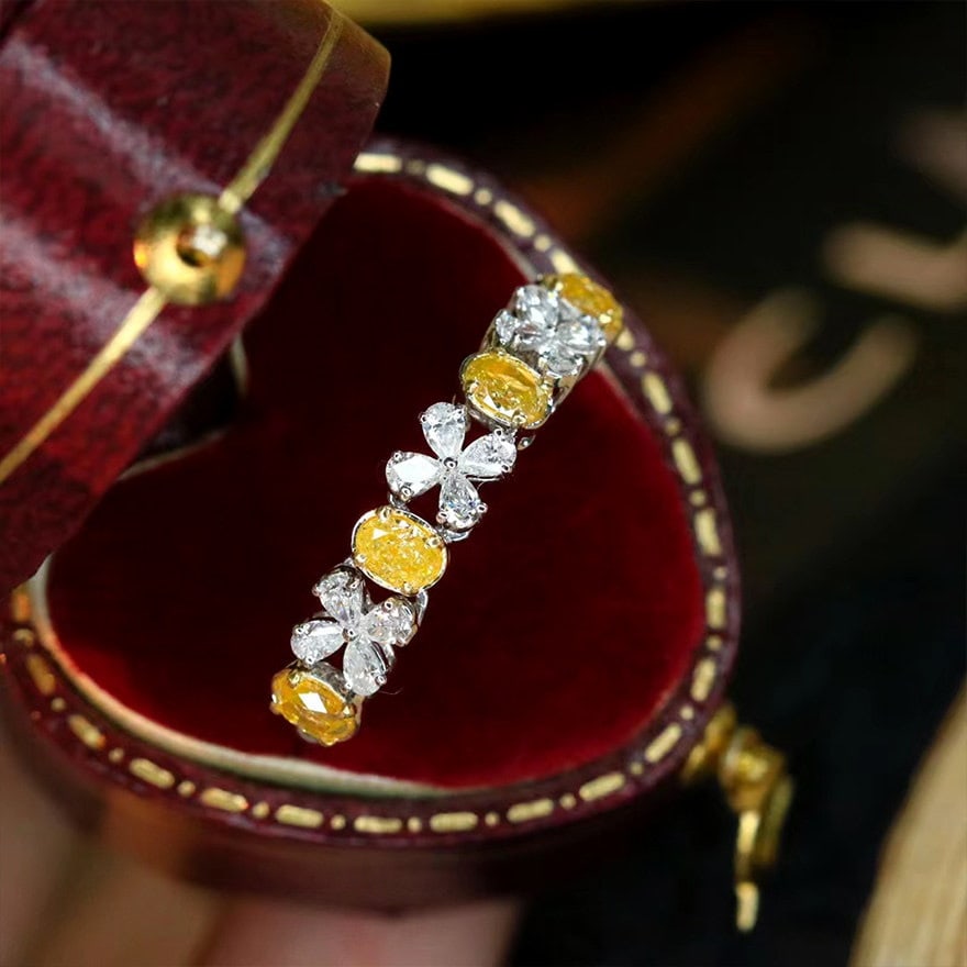 14k Gold 0.96 Ctw Natural Yellow Diamond & Diamond Ring: Ref:231106037 // gold content:14k gold // ring size:7. 25us // // main gemstone:yellow diamond // shape:oval // carat weight:0. 60ct // color:yellow // treatment:natural // // adjacent gemstone 2