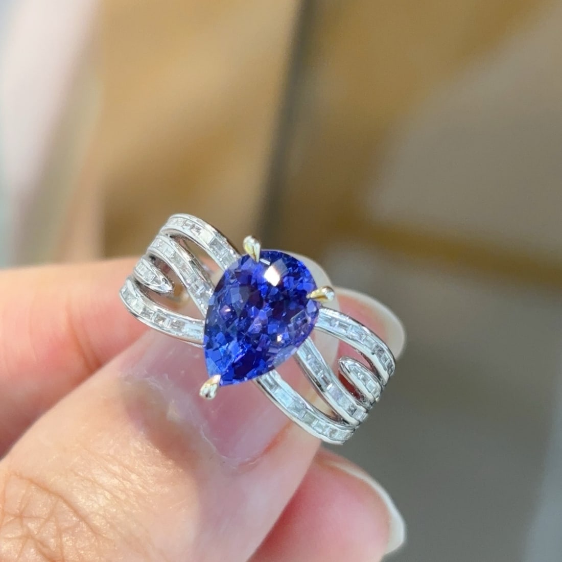 14k Gold 3.13 Ctw Natural Tanzanite & Diamond Ring: Ref:231106137 // gold content:14k gold // ring size:7. 25us // // main gemstone:tanzanite // shape:pear // carat weight:2. 6ct // color:blue // treatment:natural // // adjacent gemstone 2 :