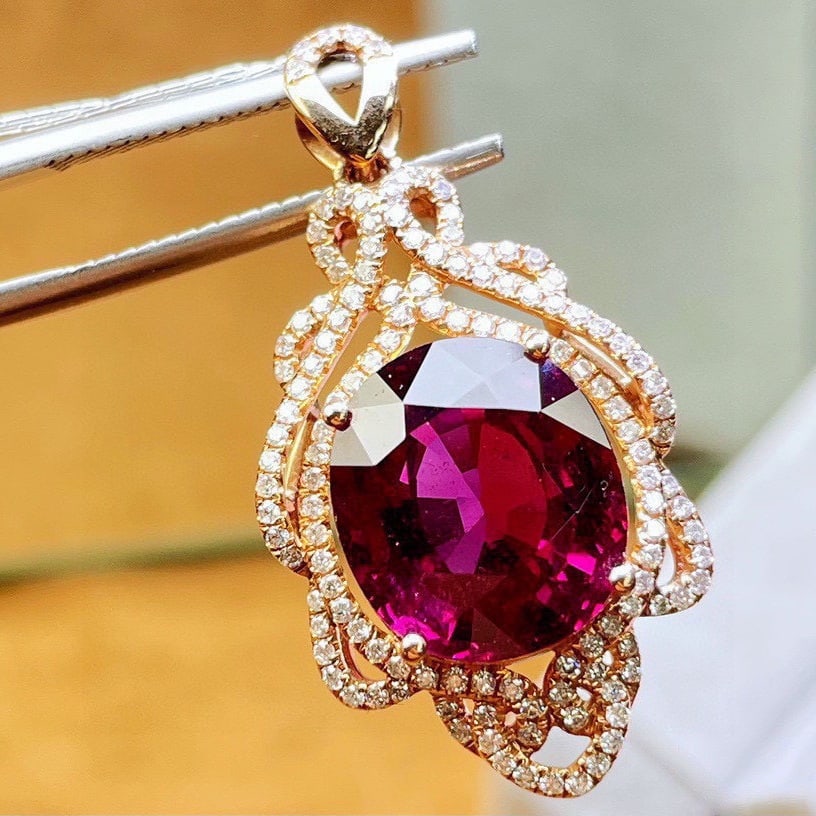 14k Gold 8.5 Ct Natural Tourmaline & Diamond Pendant( Without Chain ): Ref:231106139 // gold content:14k gold // main gemstone:tourmaline // shape:oval // carat weight:8. 5ct // color:red // treatment:natural // // adjacent gemstone 2 : diamond // shape:round //