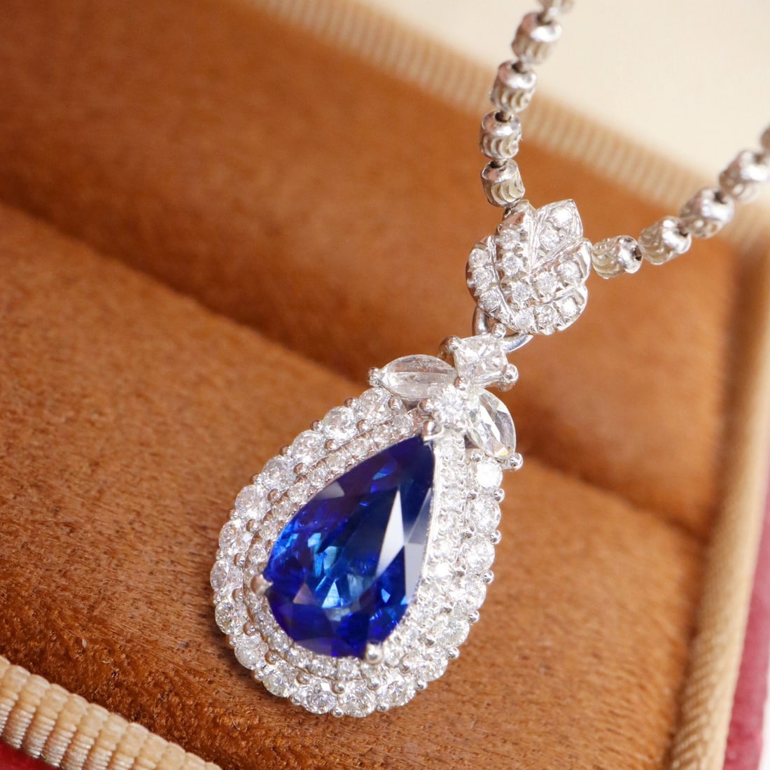 14k Gold 2.14 Ctw Natural Sapphire & Diamond Pendant( Without Chain ): Ref:231106157 // gold content:14k gold // main gemstone:sapphire // shape:pear // carat weight:1. 59ct // color:royal blue // treatment:natural // // adjacent gemstone 2 : diamond // shape:round //