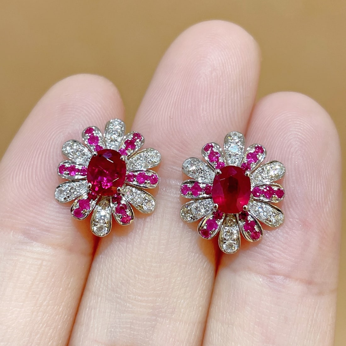 14k Gold 1.30 Ctw Natural Ruby & Ruby Earrings: Ref:231106211 // gold content:14k gold // main gemstone:ruby // shape:oval // carat weight:0. 96ct // color:red // treatment:natural // // adjacent gemstone 2 : ruby // shape:round // carat weight:0.