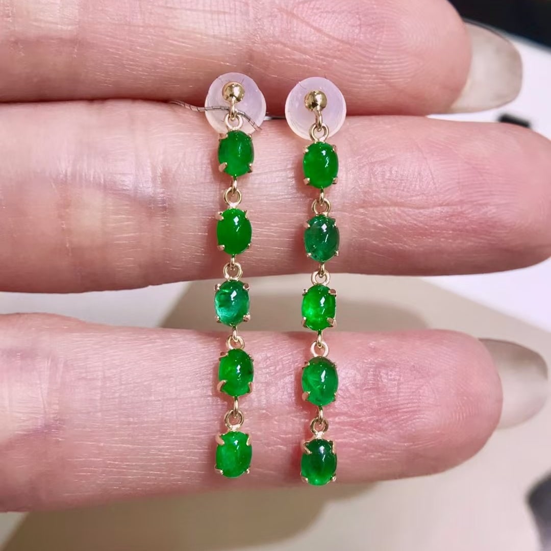 14k Gold 1.77 Ct Vivid Green Natural Emerald Earrings: Ref:231106215 // gold content:14k gold // main gemstone:emerald // shape:oval // carat weight:1. 77ct // color:vivid green // treatment:natural // Low Estimate: 2400 Condition: New High Estimate: 360