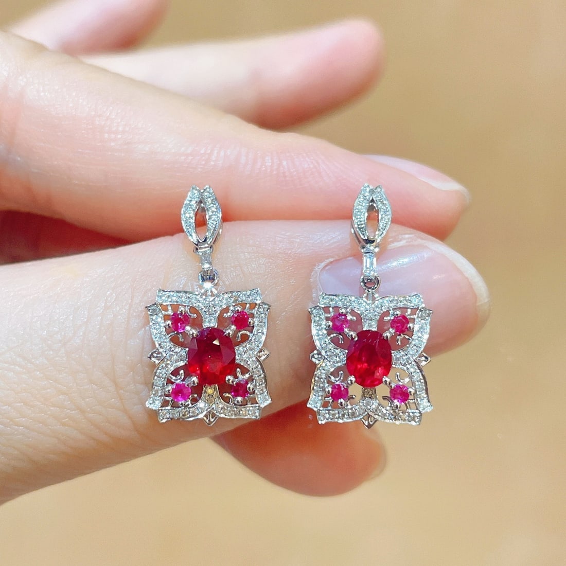 14k Gold 1.27 Ctw Natural Ruby & Diamond Earrings: Ref:231106219 // gold content:14k gold // main gemstone:ruby // shape:oval // carat weight:1. 0ct // color:red // treatment:natural // // adjacent gemstone 2 : diamond // shape:round // carat weight:0