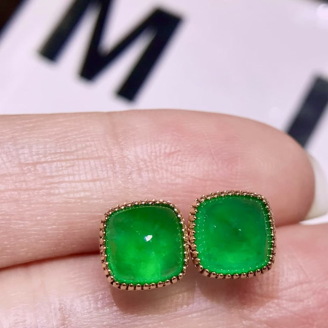 14k Gold 3.9 Ct Vivid Green Natural Emerald Earrings: Ref:231106383 // gold content:14k gold // main gemstone:emerald // shape:sugar-loaf // carat weight:3. 9ct // color:vivid green // treatment:natural // Condition: NewLow Estimate: 6600High Estimate: