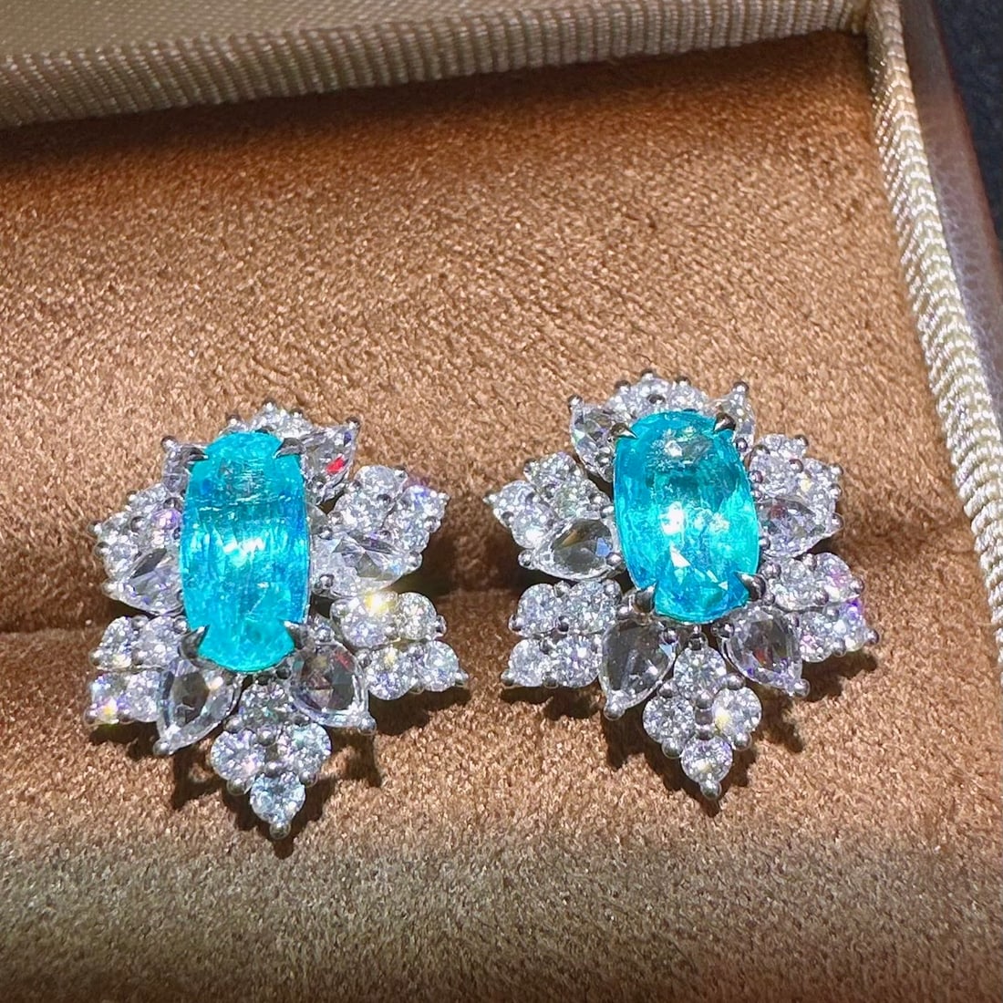 14k Gold 3.99 Ctw Natural Paraiba Tourmaline & Diamond Earrings: Ref:231106384 // gold content:14k gold // main gemstone:paraiba tourmaline // shape:oval // carat weight:2. 08ct // color:blue // treatment:natural // // adjacent gemstone 2 : diamond // shape:multipl